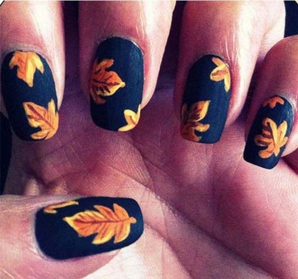 Orange Fall Leaves On Dark Blue Nail Polish #nails #fall nails #beauty #trendypins