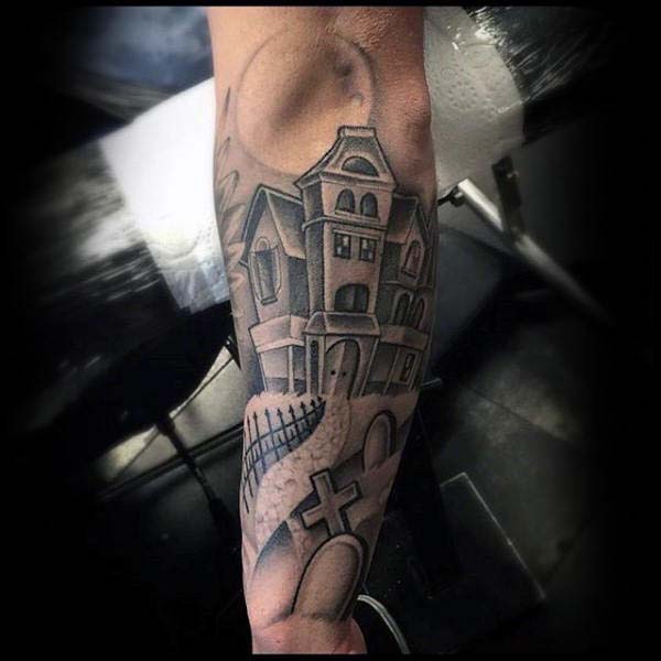 A Tattoo of a Haunted House Surrounded by Tombstones #Halloween #tattoos #trendypins