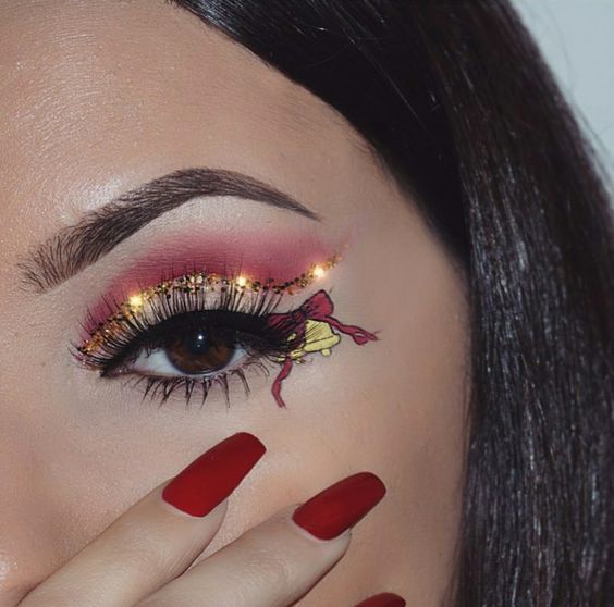 Gold Bells and Christmas Ribbon with Glowing Golden Eyeshadows #Christmas #makeup #beauty #trendypins