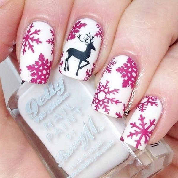 Snowflakes and a Reindeer on White Matte Base Christmas Nails #Christmas #nails #trendypins