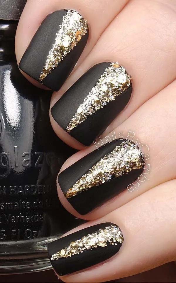 22. Elegant Black Matte Nails With V-Shaped Gold Embellishments On Top #blacknails #beauty #trendypins