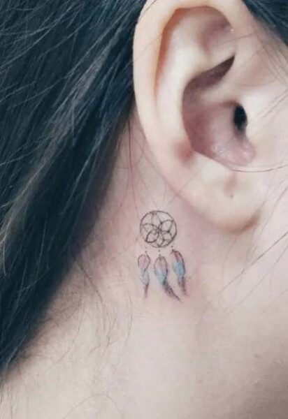 Small dream catcher tattoo behind ear