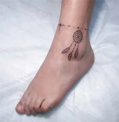 Small dream catcher tattoo on the ankle