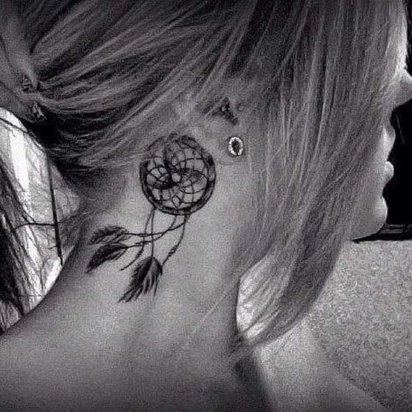 small dreamcatcher tattoo behind ear