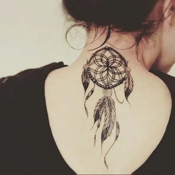 small dreamcatcher tattoo on back of neck