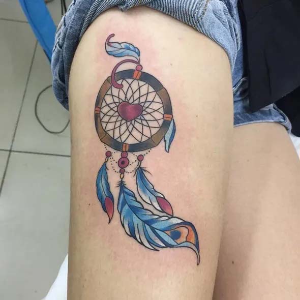 small dreamcatcher tattoo on thigh