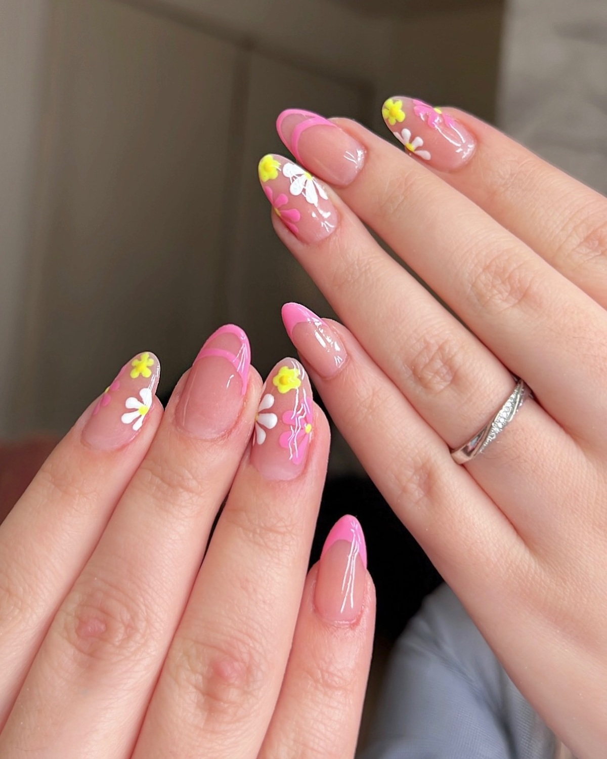 21. Neon Pink Blooms with Glossy French Tips