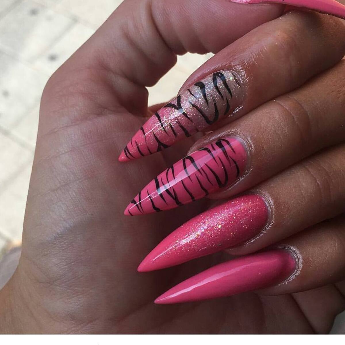 16. Wild Pink Zebra Stiletto Nails