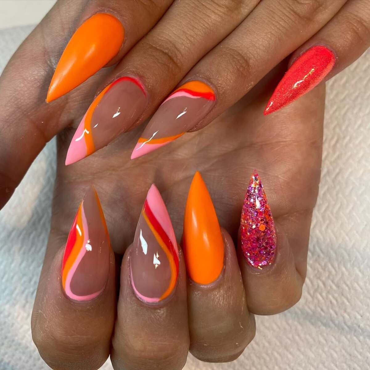 18. Sunset Neon Swirl Nails