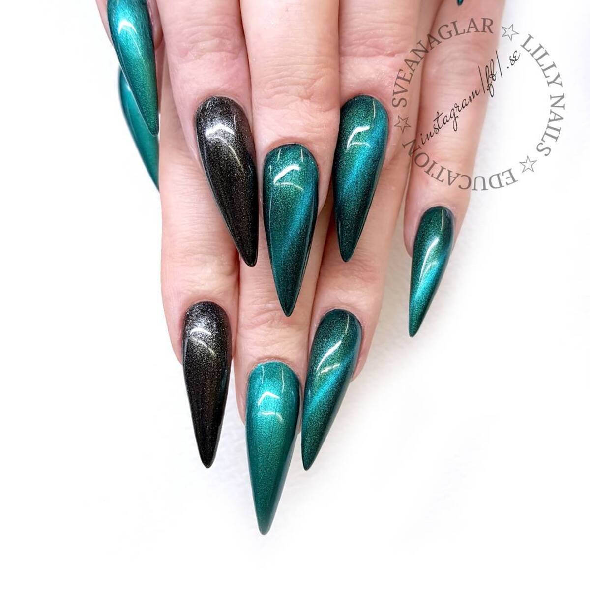 22. Metallic Emerald Stiletto Nails