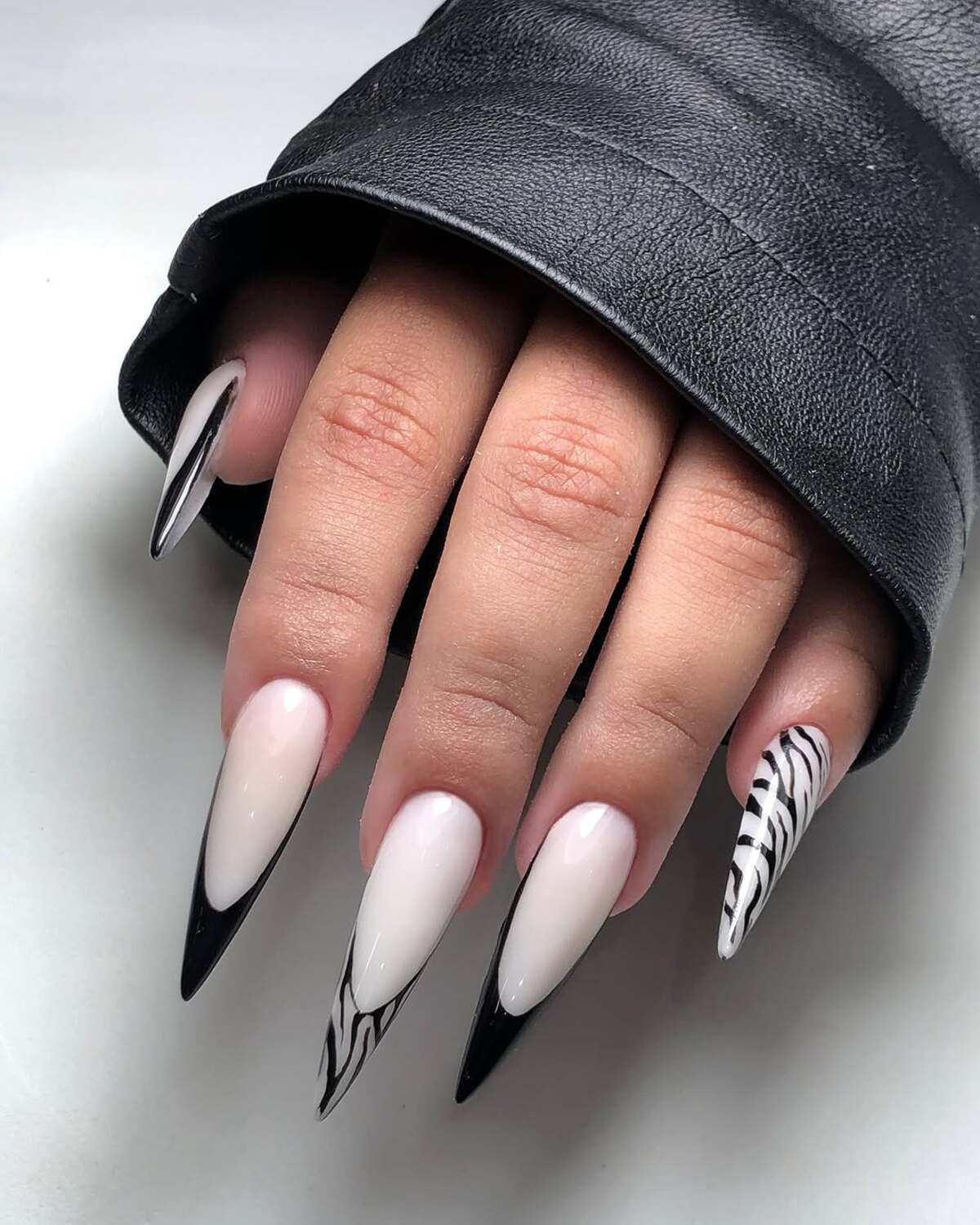 30. Sleek Black Flame French Tips