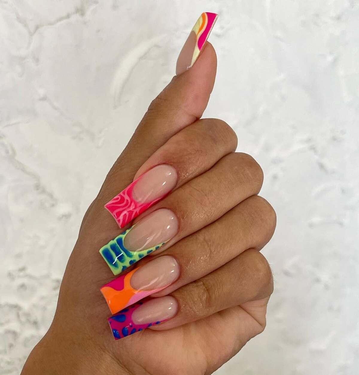 1. Bold and Colorful Abstract Acrylic Nails