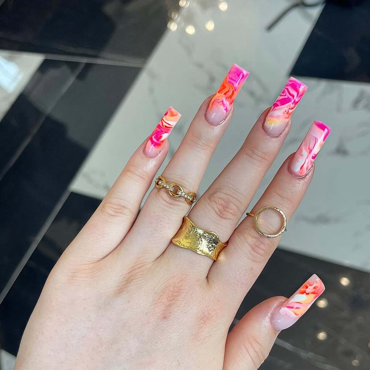 5. Fiery Pink and Orange Marble Nails