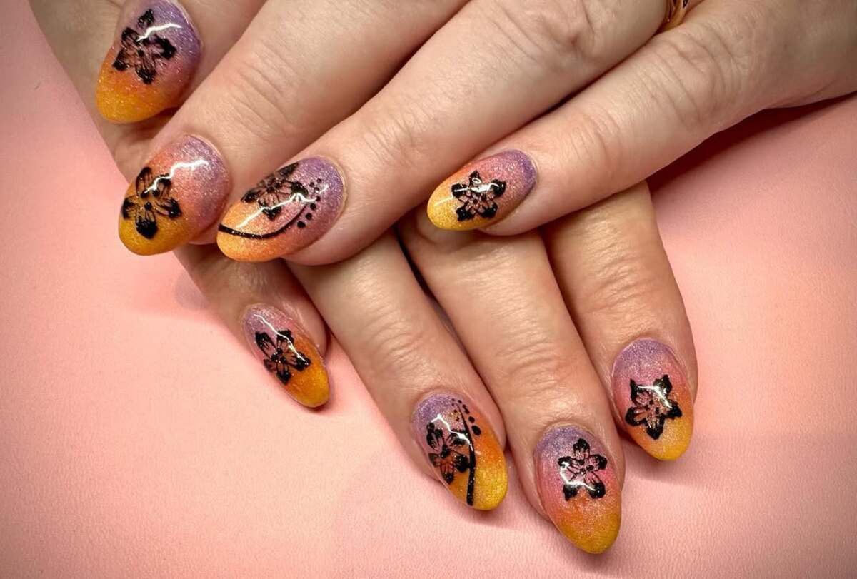 26. Glittery Sunset with Black Floral Details