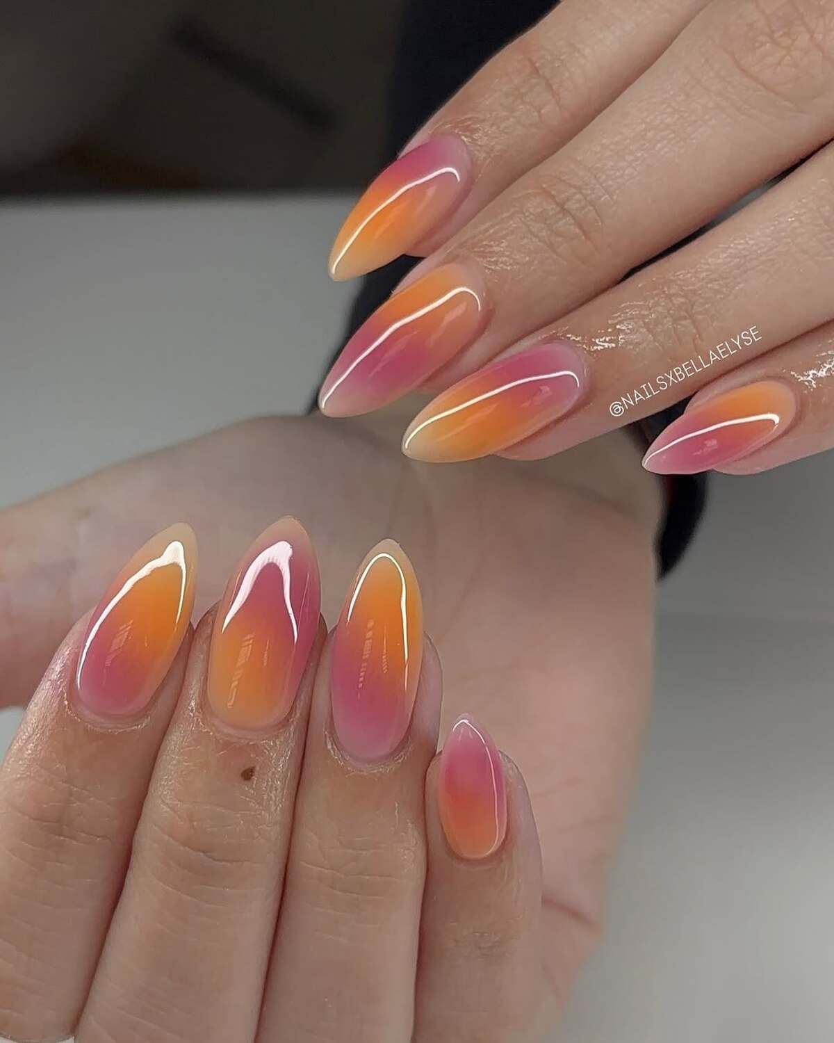 2. Sunset-Inspired Ombre Stiletto Nails