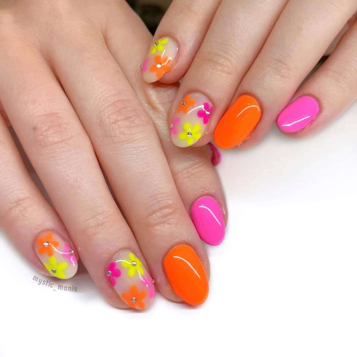 20. Playful Neon Floral Nails for a Fun Twist