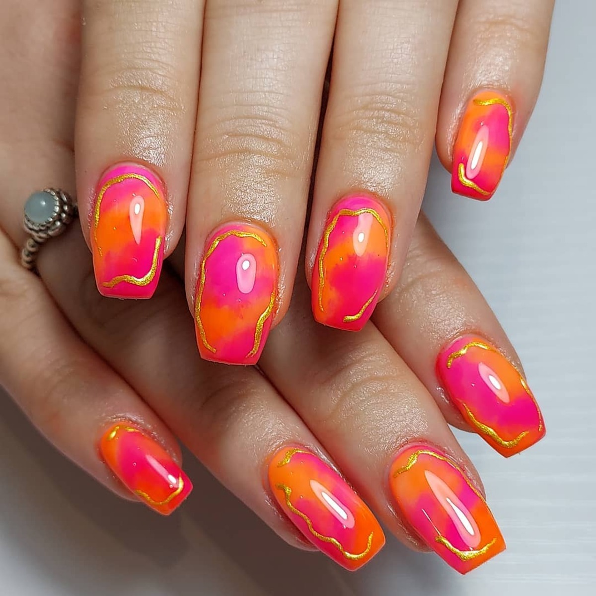 21. Fiery Neon Aura Nails with Gold Accents