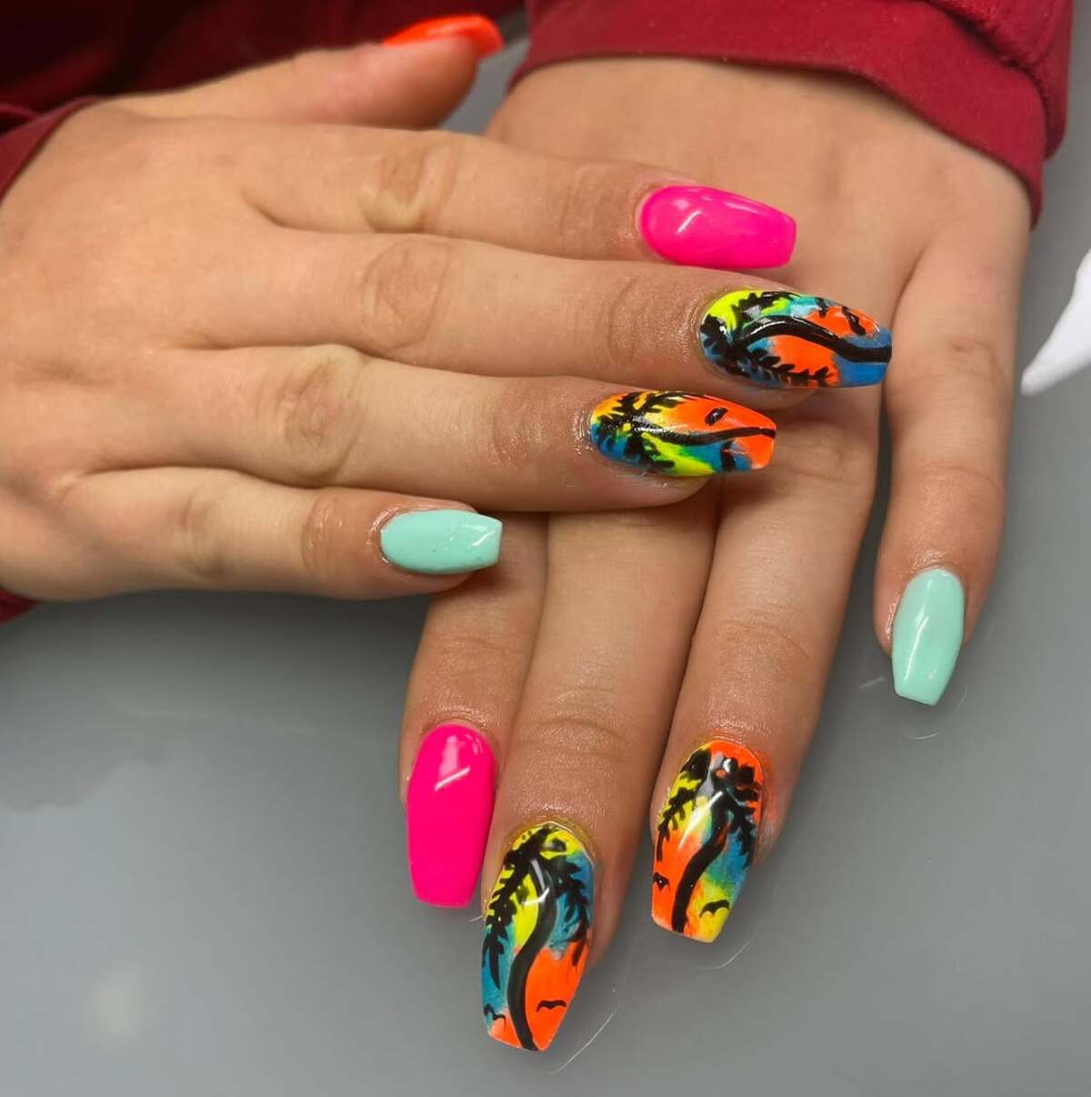 20. Neon Sunset with Ocean Blue and Palm Silhouettes