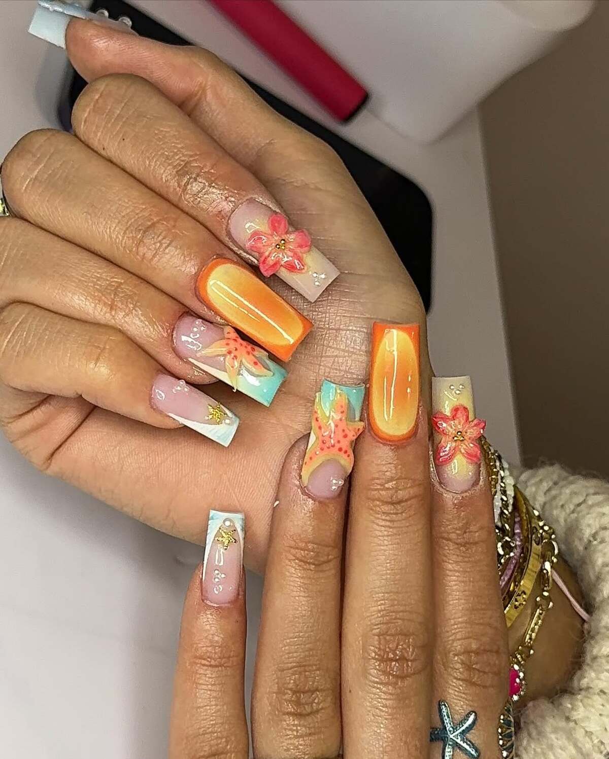 23. 3D Starfish and Seashells on Ocean-Inspired Nails