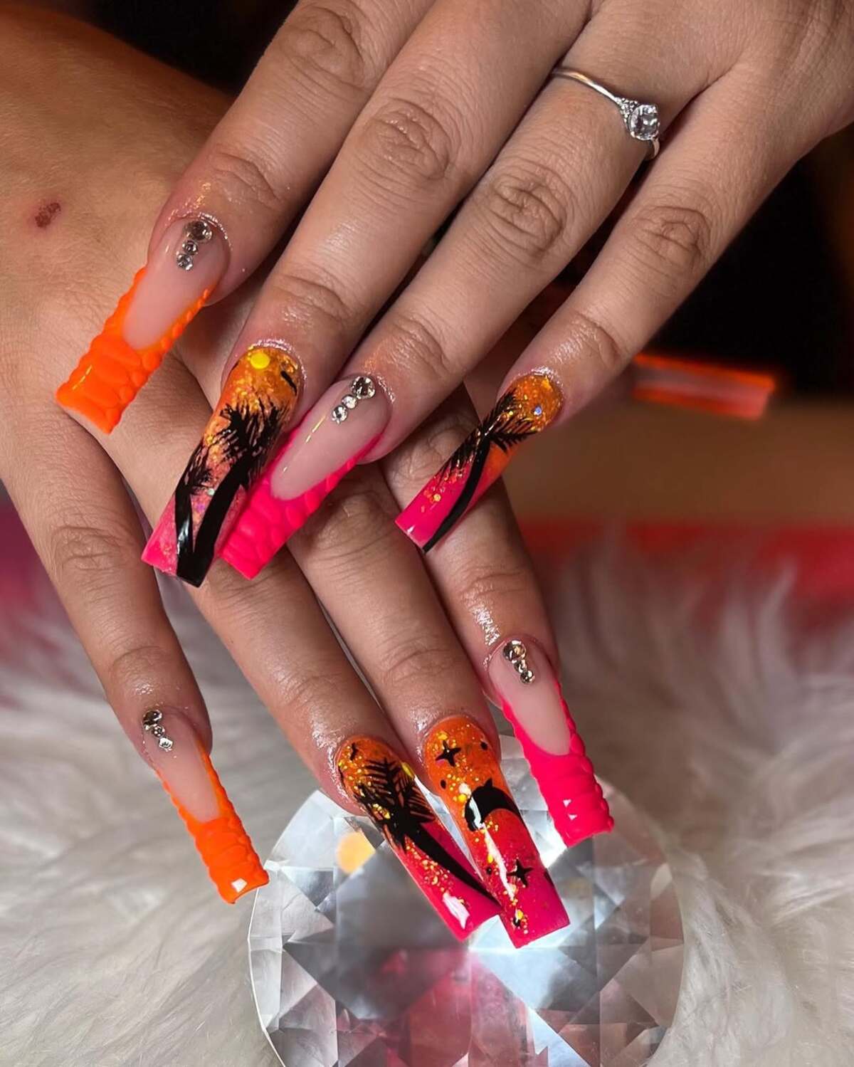 25. Sunset Glow with Rhinestones and Palm Trees