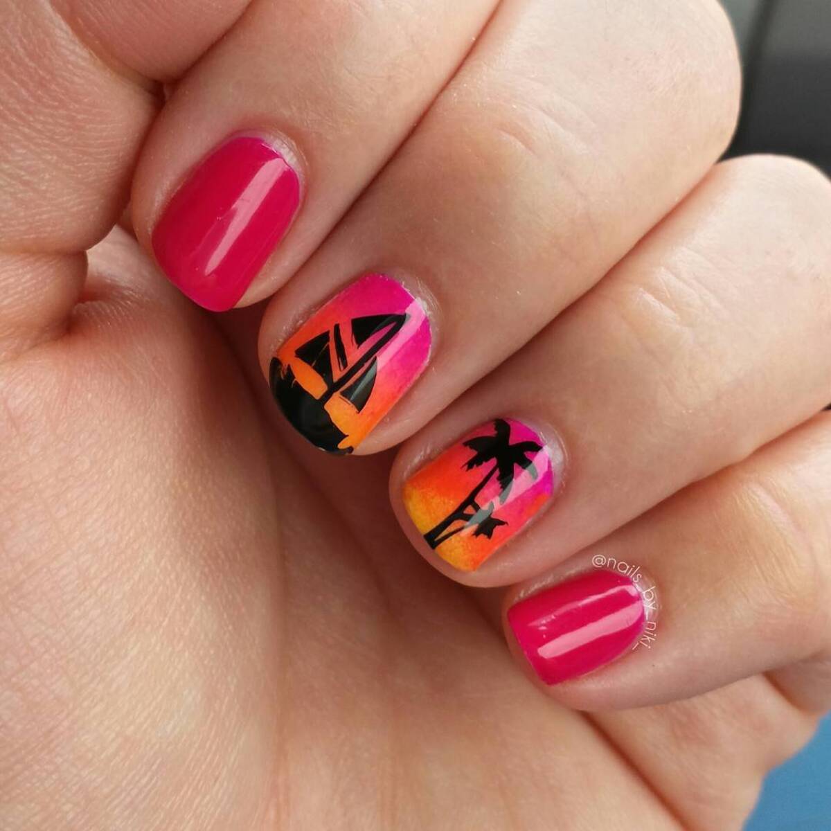 27. Minimalist Sunset Nails with Sailboat Accents