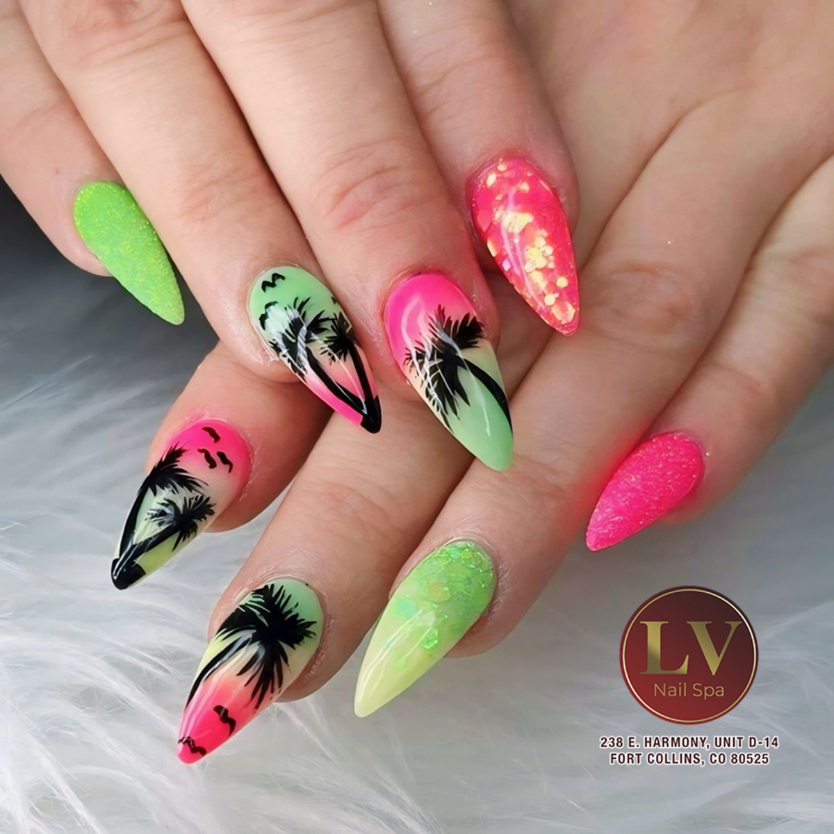 9. Tropical Sunset Stiletto Nails with Neon Flair
