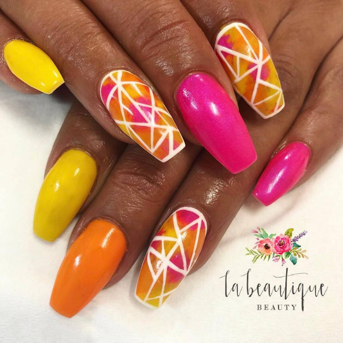 10. Sunset-Inspired Geometric Neon Nails