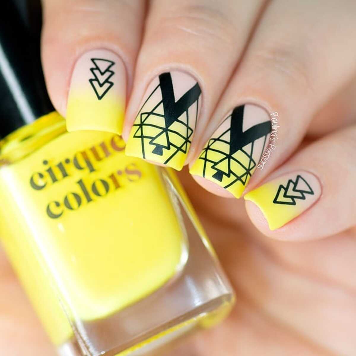 2. Bold Neon Yellow and Black Geometric Nails