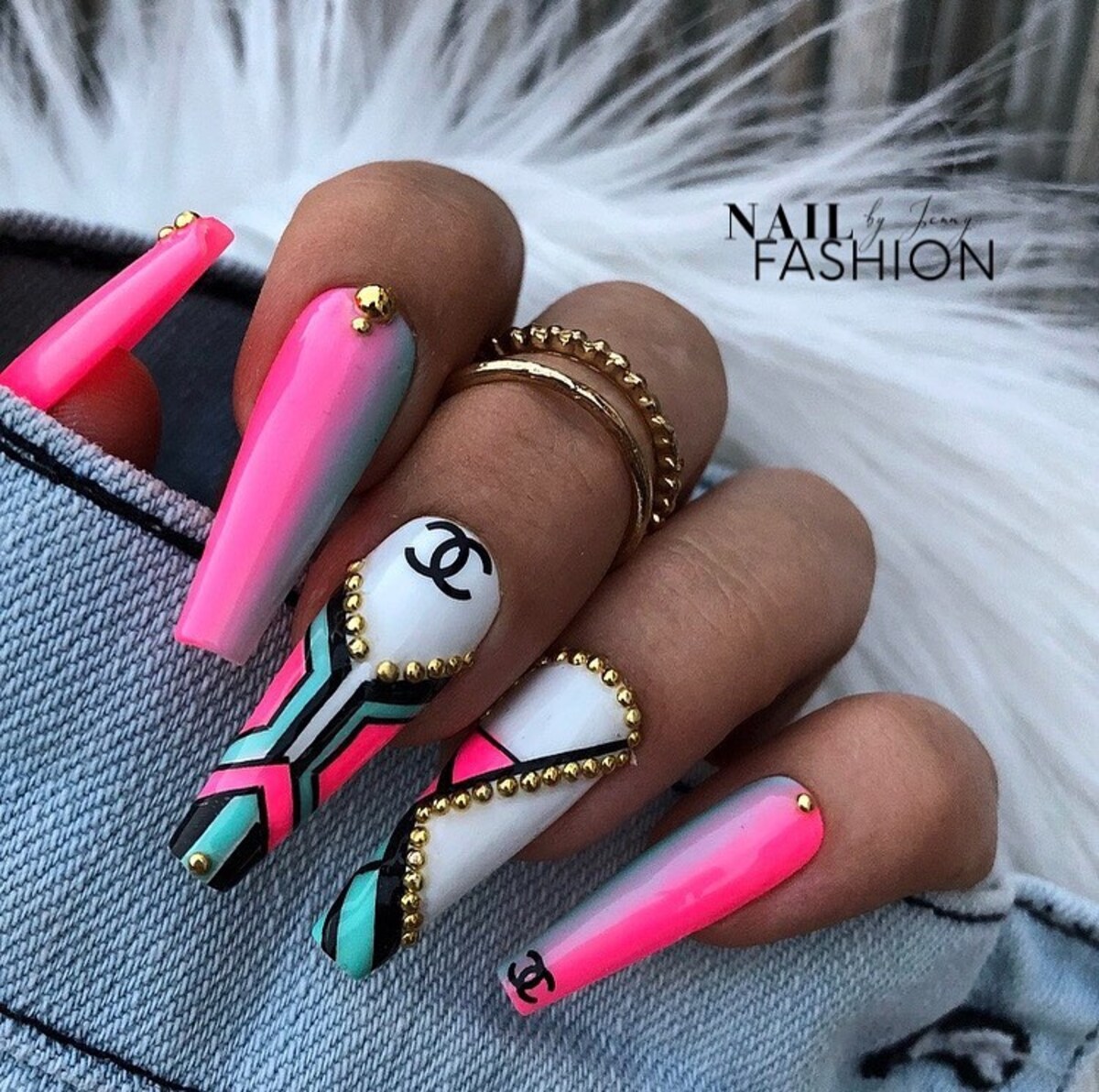 3. Luxurious Neon Pink and Gold Embellished Nails