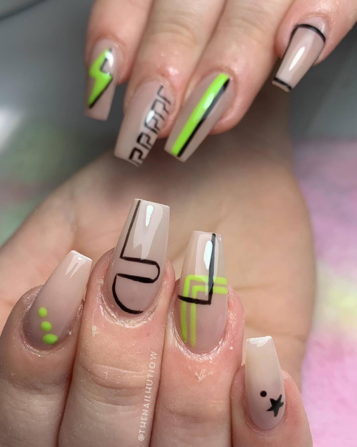 6. Minimalist Neon and Black Graphic Coffin Nails