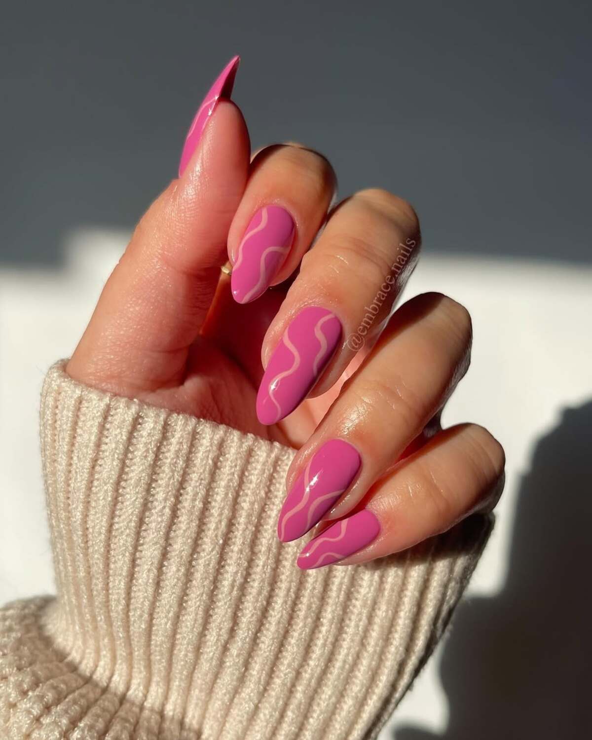 13. Bold Pink Nails with Abstract Swirls