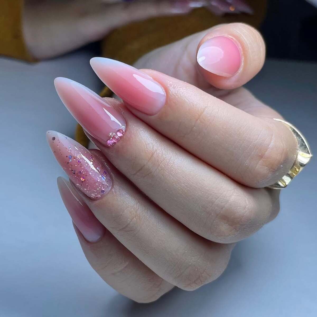 16. Elegant Pink Ombré Nails with Subtle Sparkle