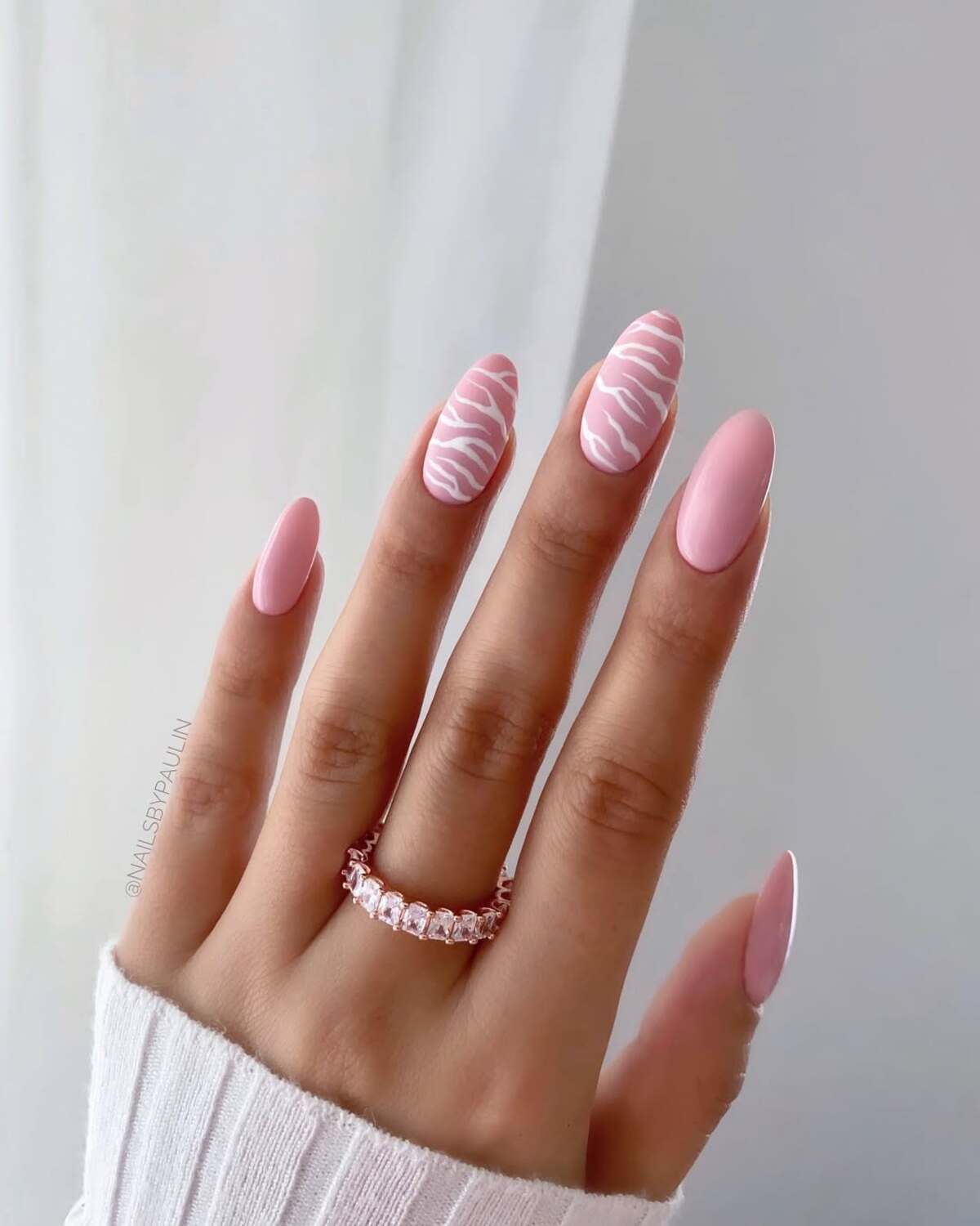 18. Soft Pink Zebra Print Nails for a Trendy Touch