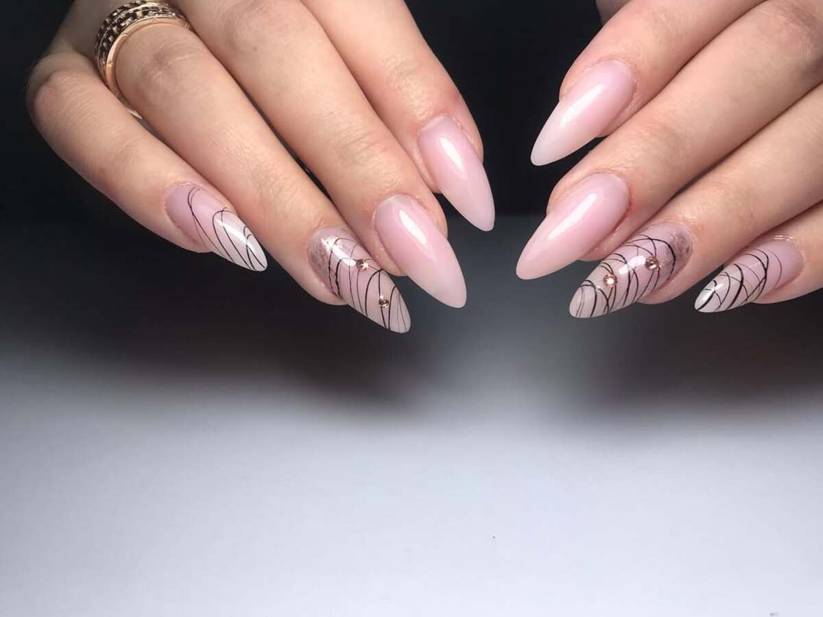 21. Soft Pink Stiletto Nails with Abstract Line Art