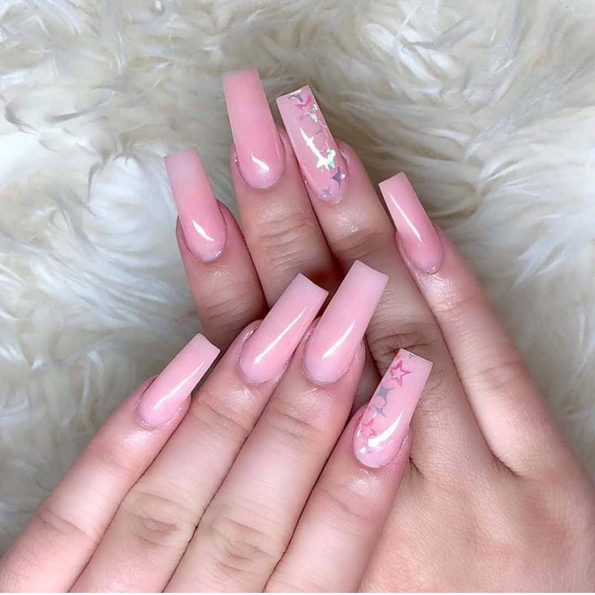27. Long Pink Coffin Nails with Subtle Star Details
