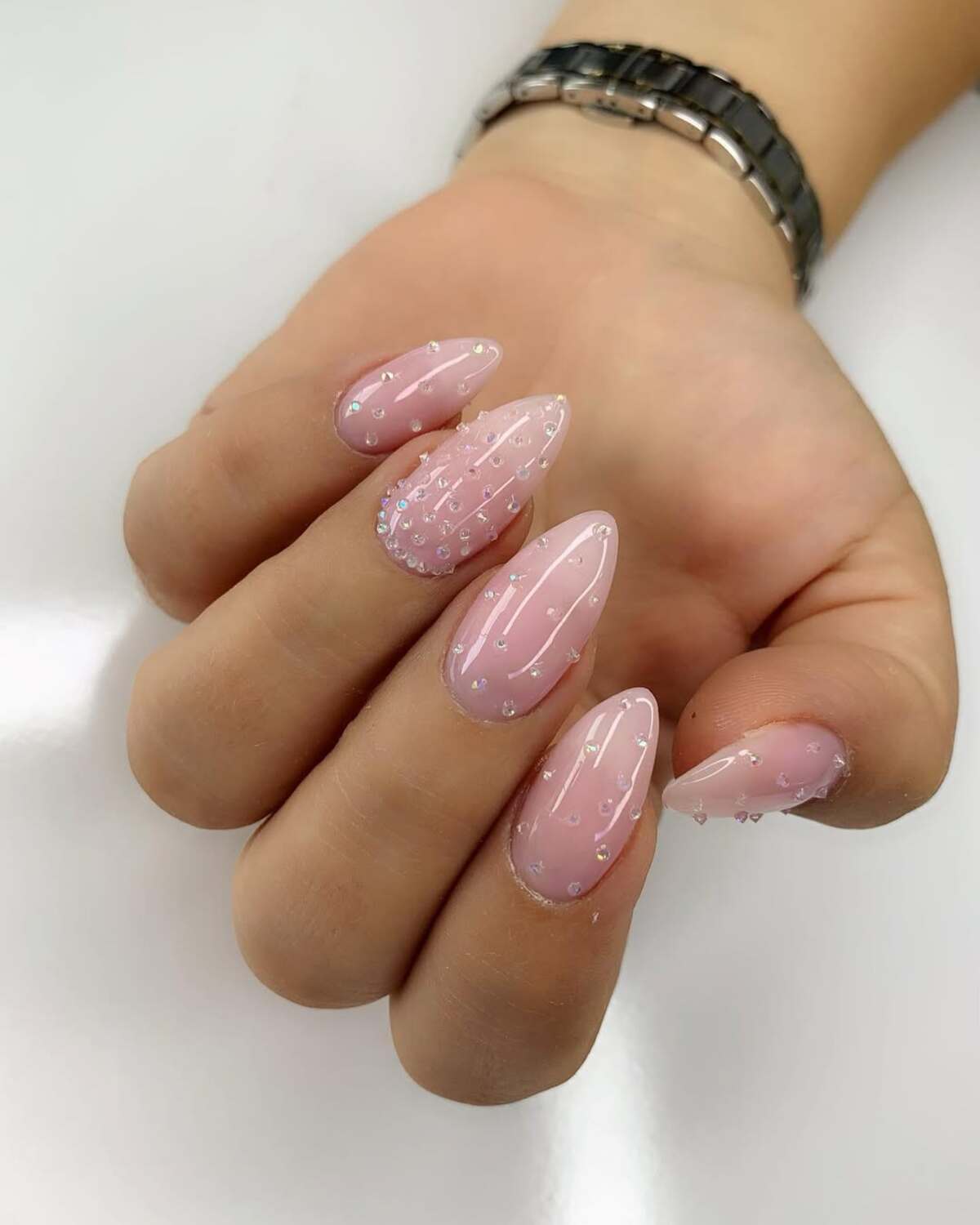 28. Sheer Pink Nails with Crystal Rain Effect