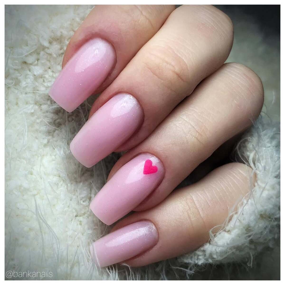29. Soft Pink Nails with a Tiny Heart Accent