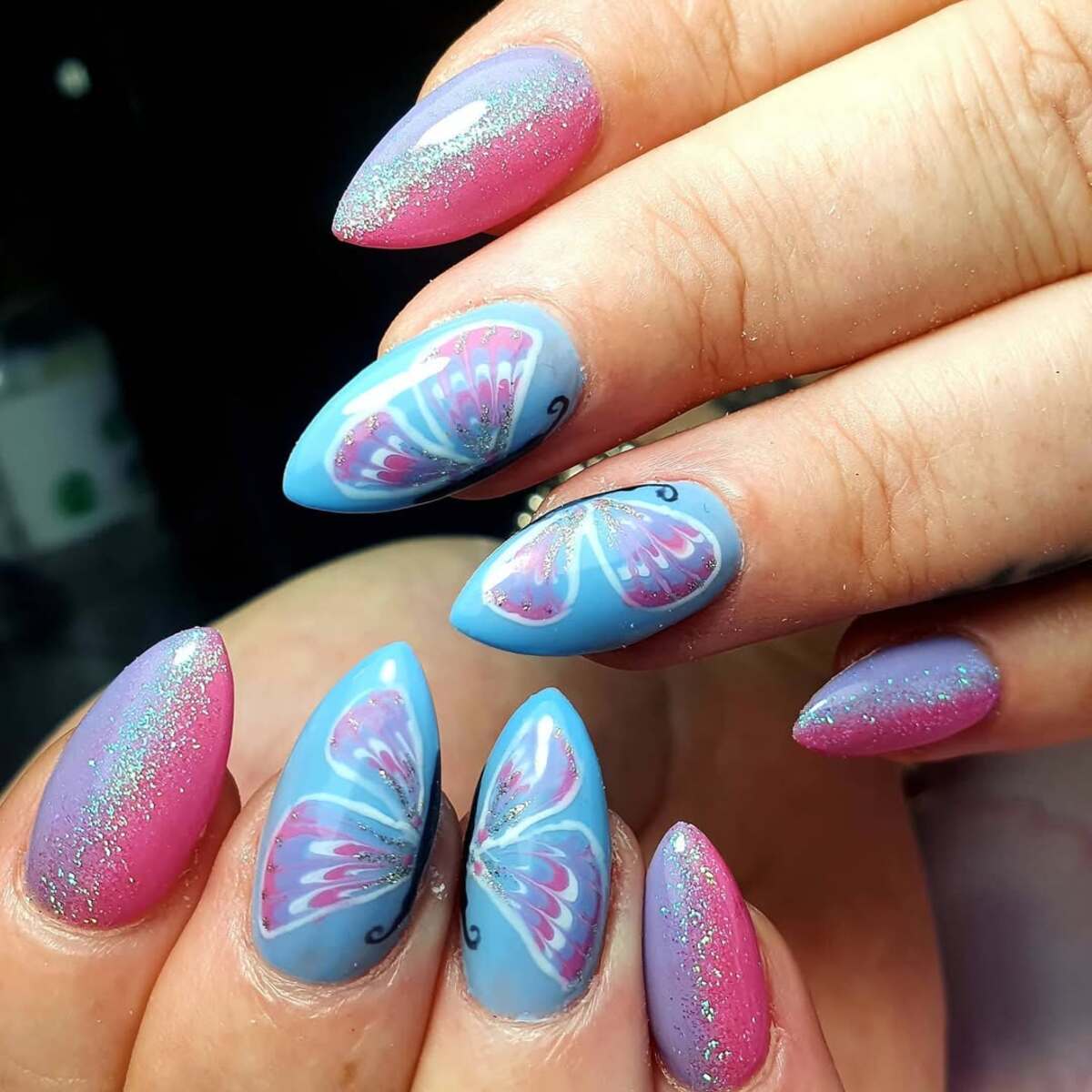 10. Whimsical Butterfly Stiletto Nails in Pink and Aqua