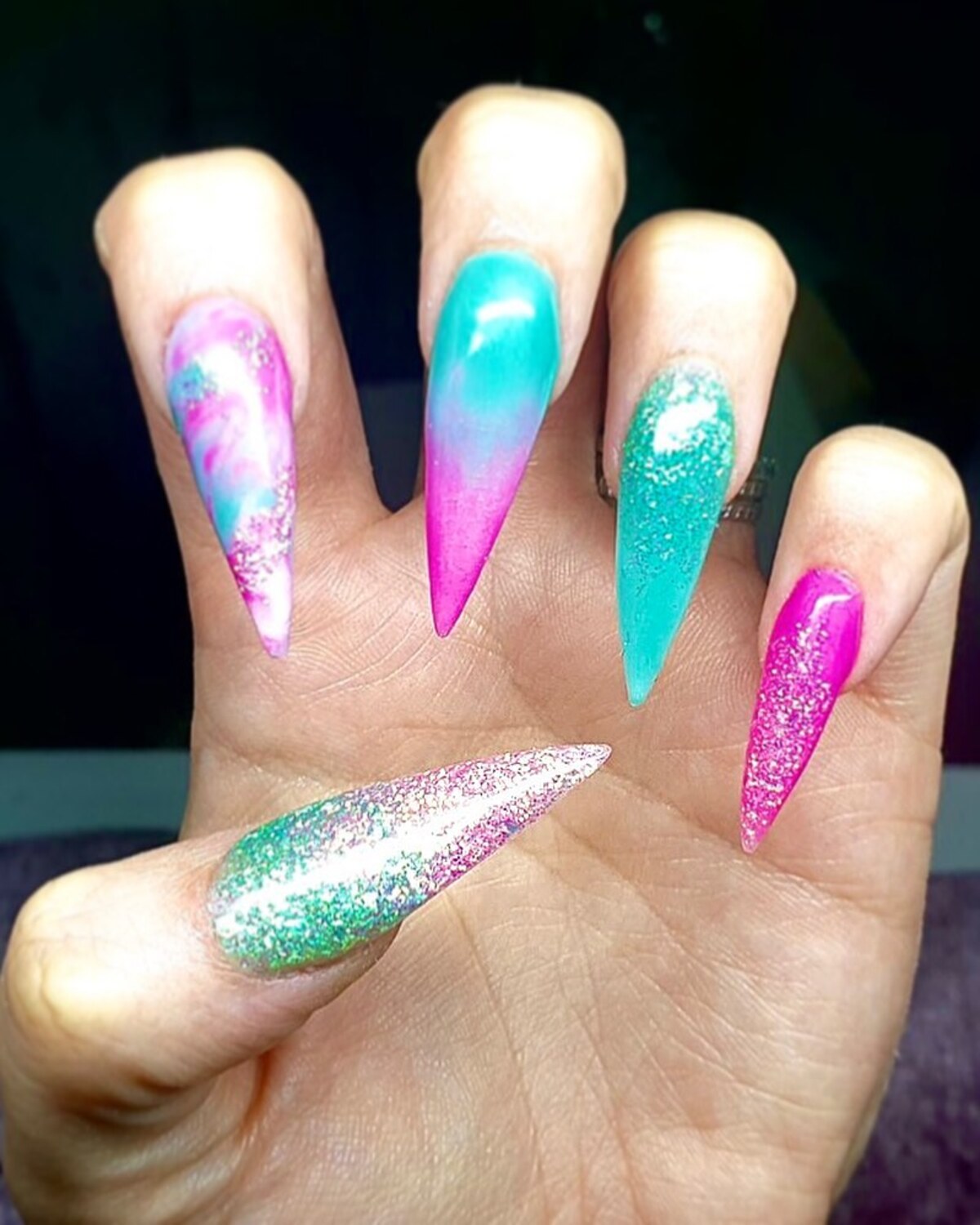 14. Extreme Stiletto Nails with Vibrant Pink and Aqua Ombré