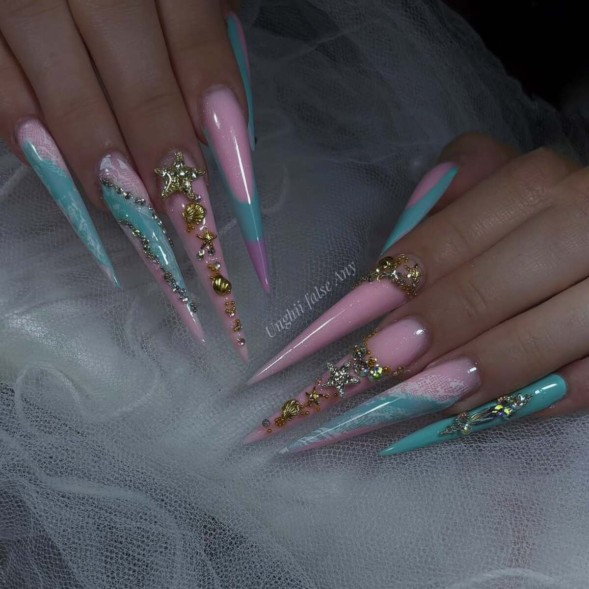15. Luxurious Mermaid-Inspired Stiletto Nails with Gold Accents