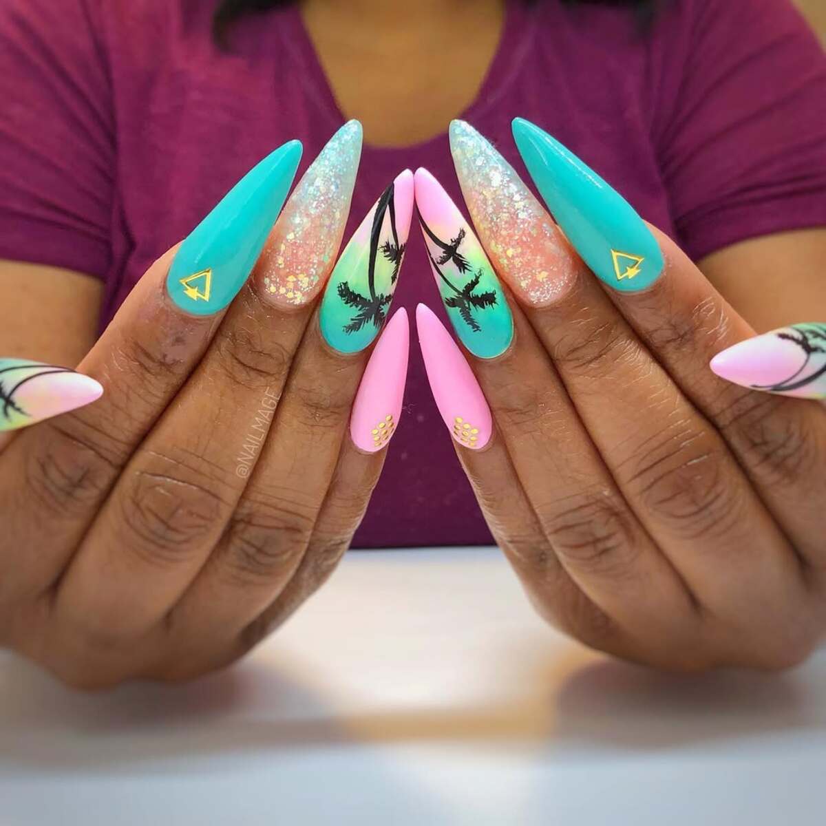 18. Sunset Paradise Stiletto Nails with Palm Tree Art