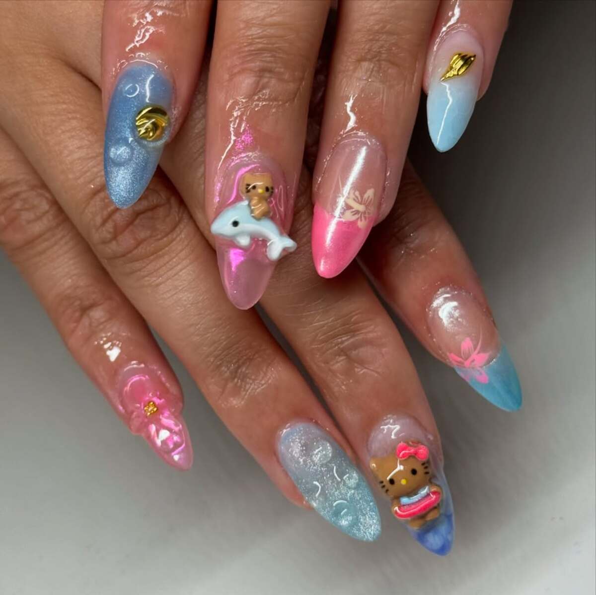 27. Adorable Ocean-Themed Stiletto Nails with 3D Beach Charms