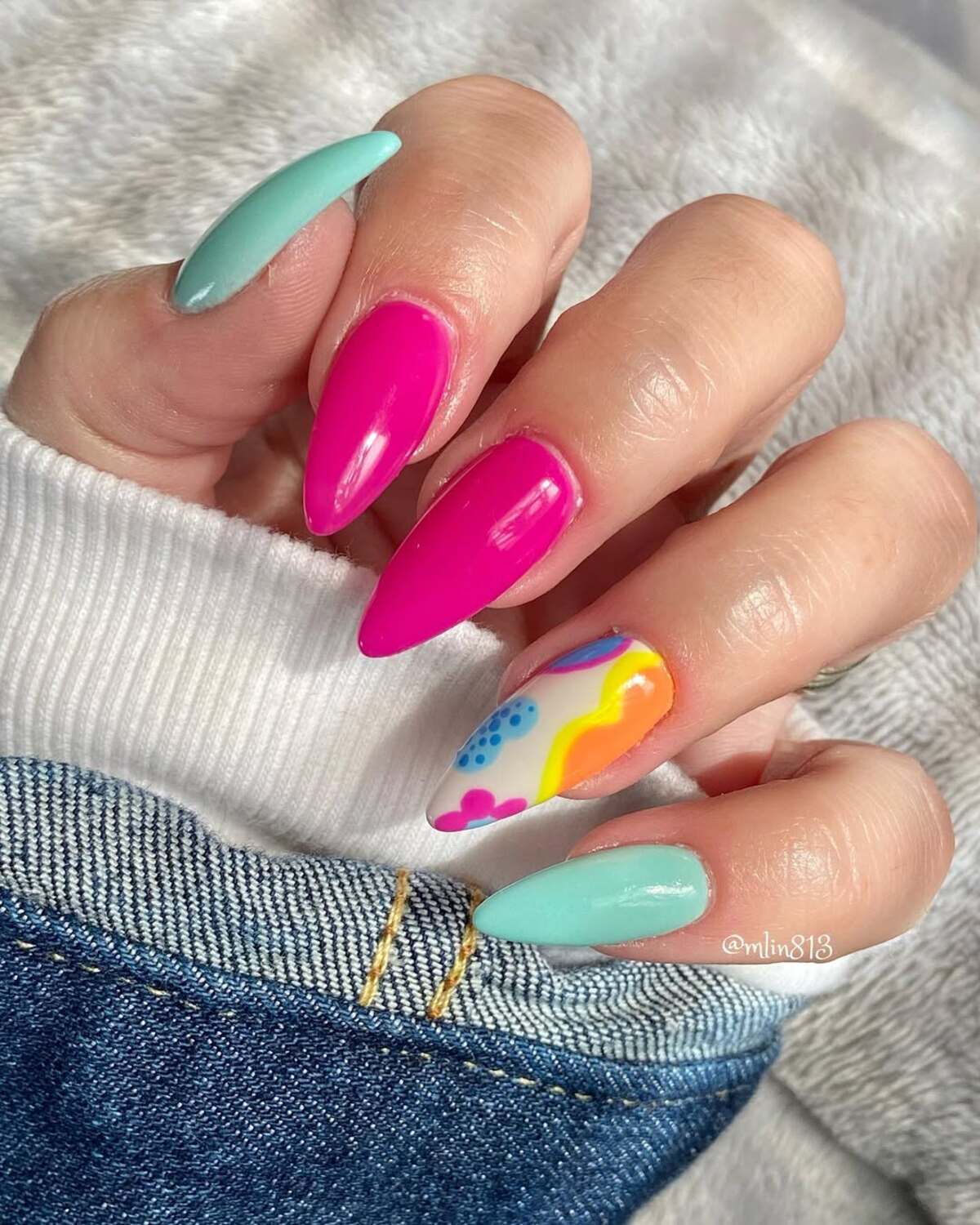 5. Bold Hot Pink and Aqua Stiletto Nails with a Playful Twist