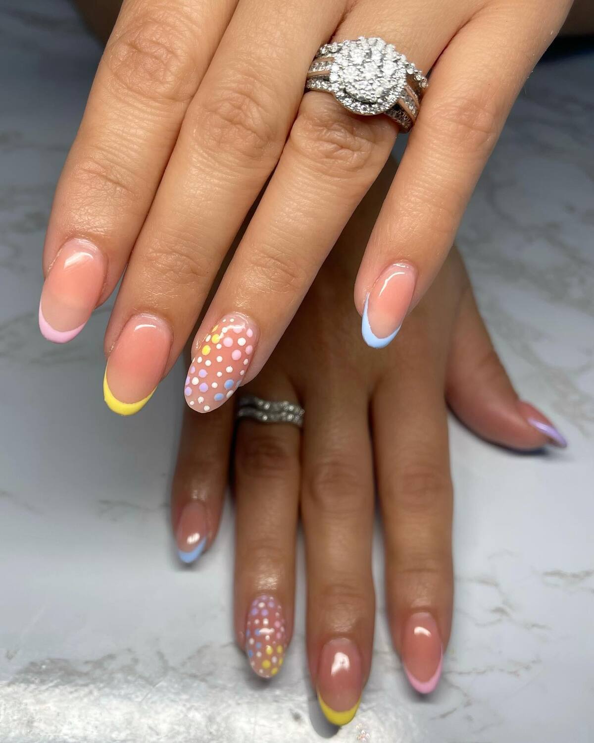 10. Soft French Tips with Easter Polka Dot Accent Nails
