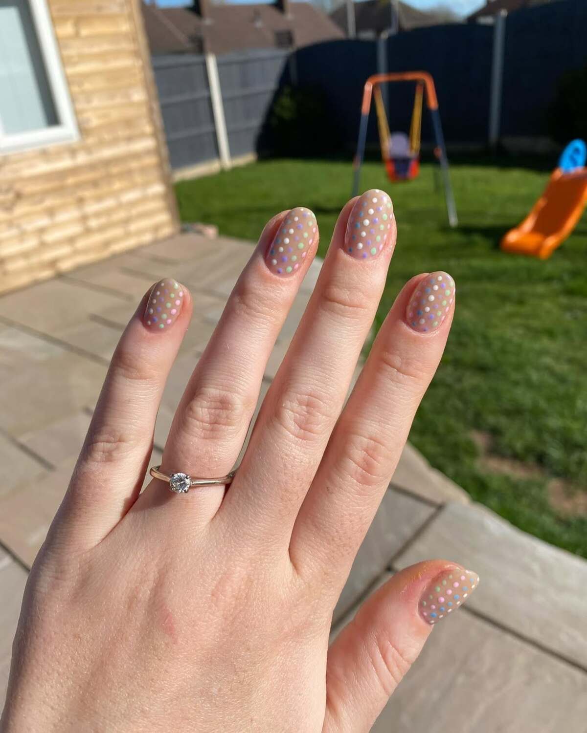 20. Sheer Nude Nails with Tiny Pastel Polka Dots