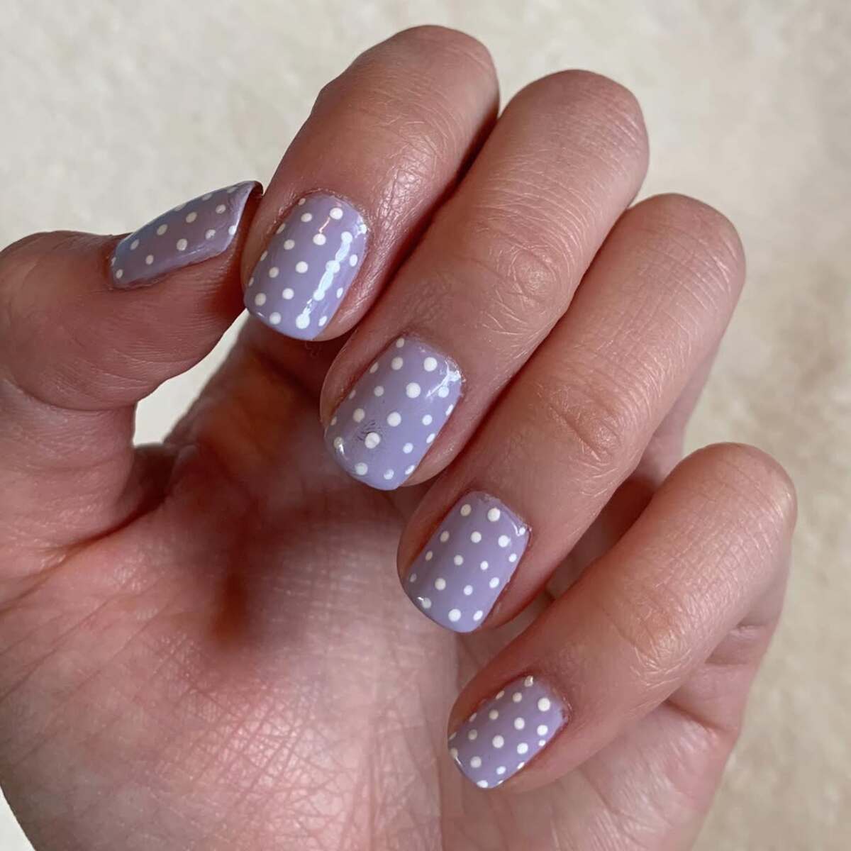 8. Chic Lavender Nails with Classic White Polka Dots