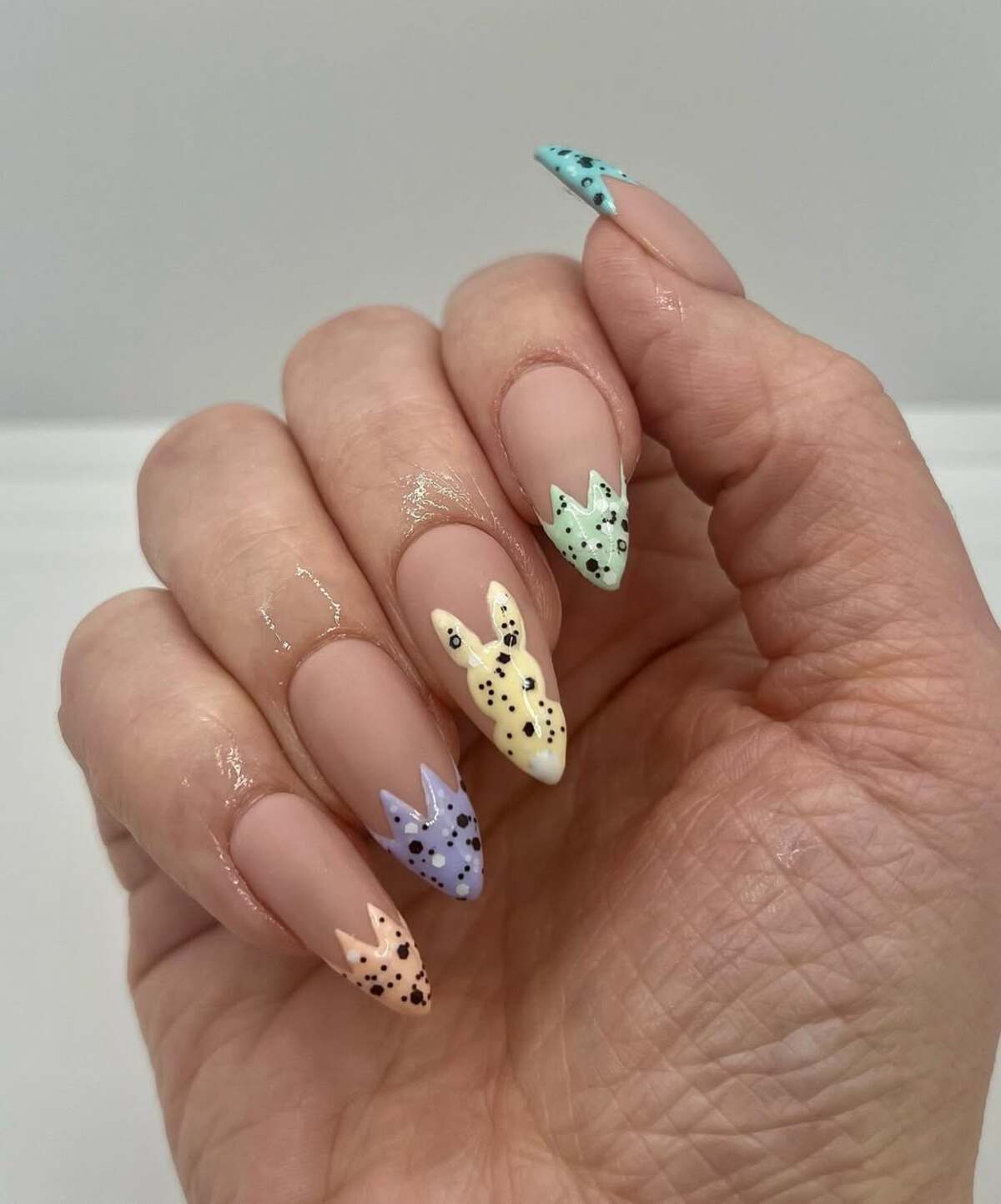 3. Minimalist Bunny Tips with a Speckled Effect