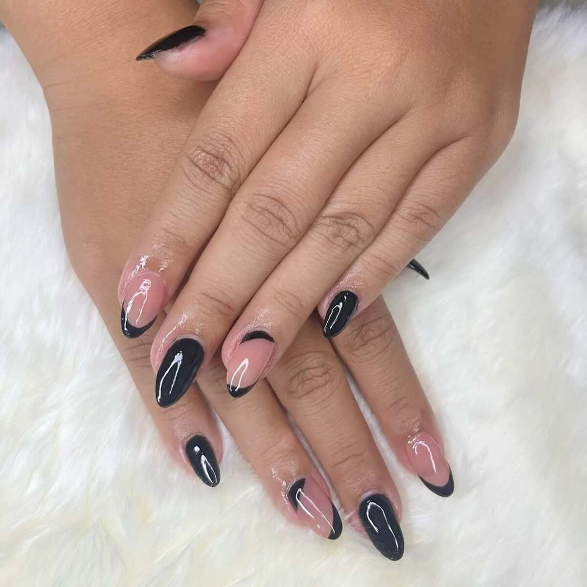 24. Edgy Black French Tips with Abstract Swirls