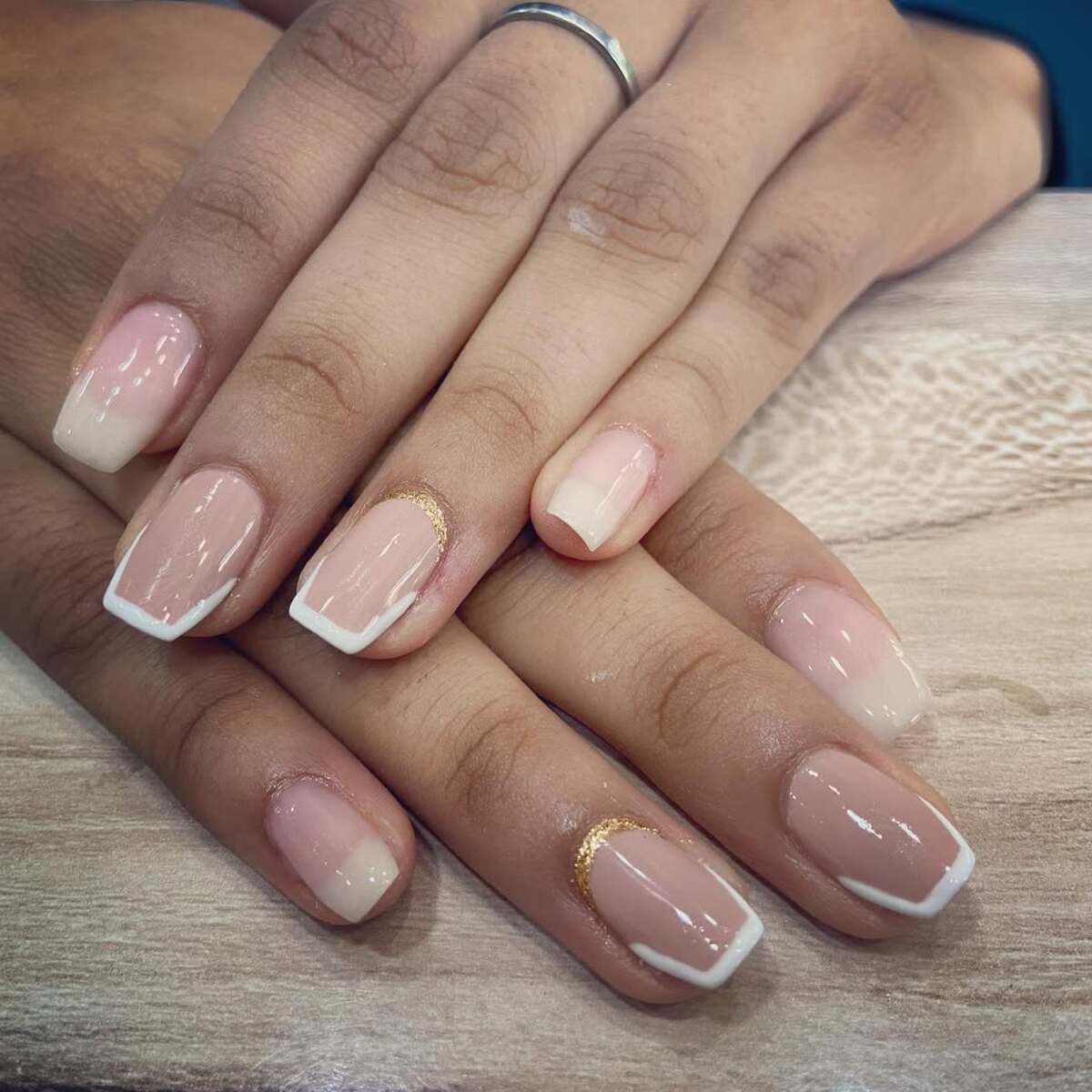 27. Ombre French Tips with Gold Accents