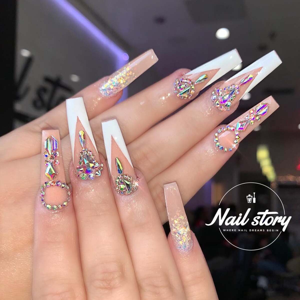 7. Dramatic French Tip with a Rhinestone Twist